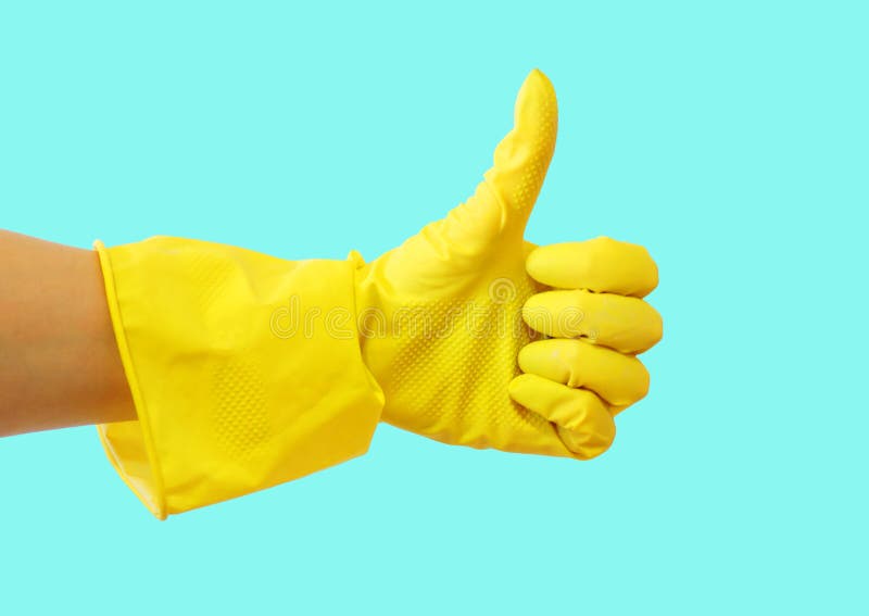 Getting started cleaning. Yellow rubber gloves for cleaning on blue background .General or regular cleanup. stock photo Getting started cleaning. Yellow rubber gloves for cleaning on blue background .General or regular cleanup. stock photo