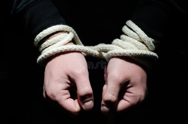 Hands tied up with rope. Hands tied up with rope