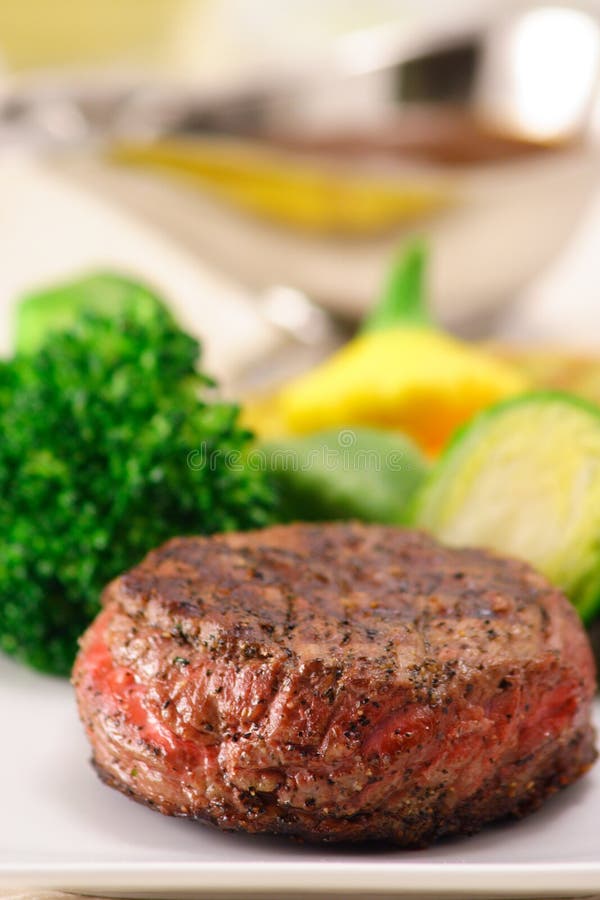 Incredible grilled to perfection fine gourmet fillet mignon with steamed vegetables. Incredible grilled to perfection fine gourmet fillet mignon with steamed vegetables