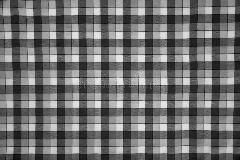 Detail of fabric print with black and white grid. Detail of fabric print with black and white grid