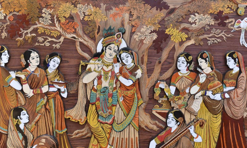 Raised crafted Indian Hindu Gods Krishna and Radha on wood, whole background. Krishna and Radha's love is considered true form of love. Raised crafted Indian Hindu Gods Krishna and Radha on wood, whole background. Krishna and Radha's love is considered true form of love.