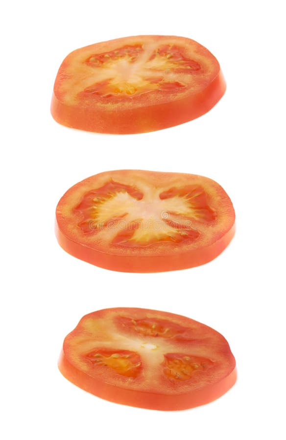 Geïsoleerde de plak van de tomatendwarsdoorsnede stock foto Geïsoleerde de plak van de tomatendwarsdoorsnede stock foto