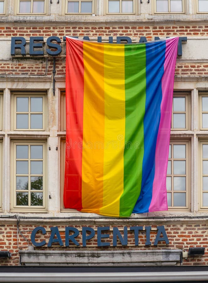 Ghent/Belgium - October 10, 2019: Facade of a restaurant with gay pride flag. Rainbow flag of the LGBT community as a symbol of stock photos Ghent/Belgium - October 10, 2019: Facade of a restaurant with gay pride flag. Rainbow flag of the LGBT community as a symbol of stock photos
