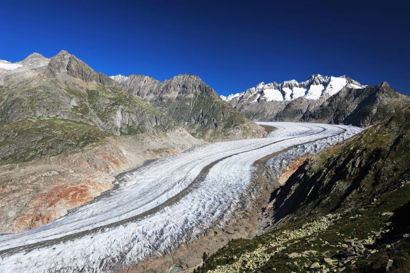 Aletsch Glacier and the summits of Fiescher Gabelhorn, Schönbühlhorn, Wannenhorn in Valais, Switzerland, on a bright morning. Aletsch Glacier and the summits of Fiescher Gabelhorn, Schönbühlhorn, Wannenhorn in Valais, Switzerland, on a bright morning