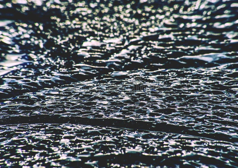 Ghiaccio e crepe ghiacciate su superficie del lago congelato Struttura del ghiaccio del ghiacciaio fotografie stock Ghiaccio e crepe ghiacciate su superficie del lago congelato Struttura del ghiaccio del ghiacciaio fotografie stock