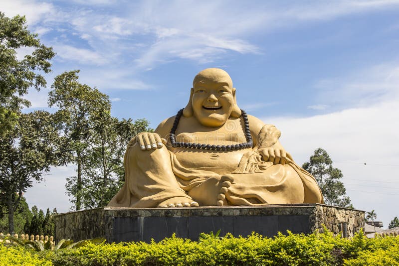 Giant buda and blue sky background, Buddhist Temple, Foz do Iguacu, Brazil. Giant buda and blue sky background, Buddhist Temple, Foz do Iguacu, Brazil.