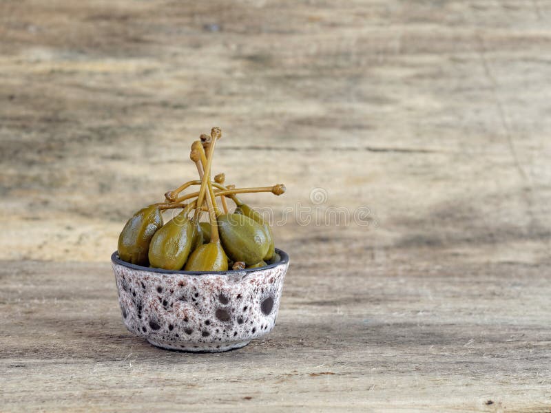 Giant capers in a bowl stock image