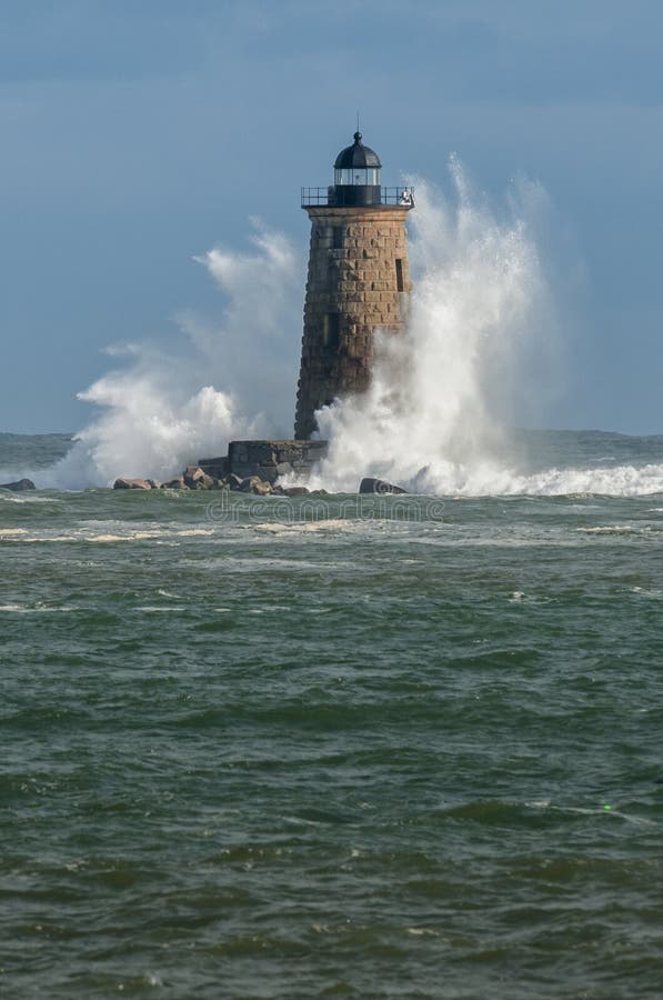 Giant Waves Surround Stone Lighthouse in Maine