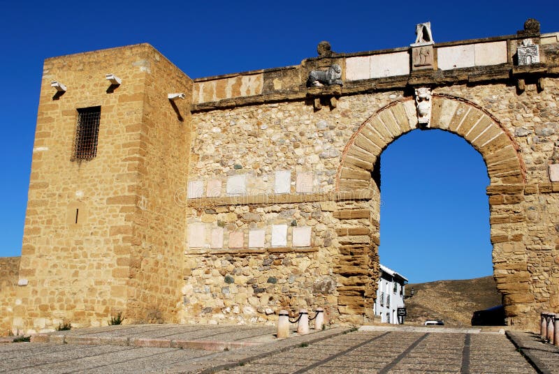 Statue of Pedro Espinosa in the Plaza de Santa Maria with a pavement cafe  and the giants arch to the rear, Antequera, Spain Stock Photo - Alamy