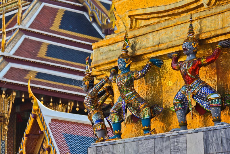 Giants and monkeys hand to lift golden pagoda