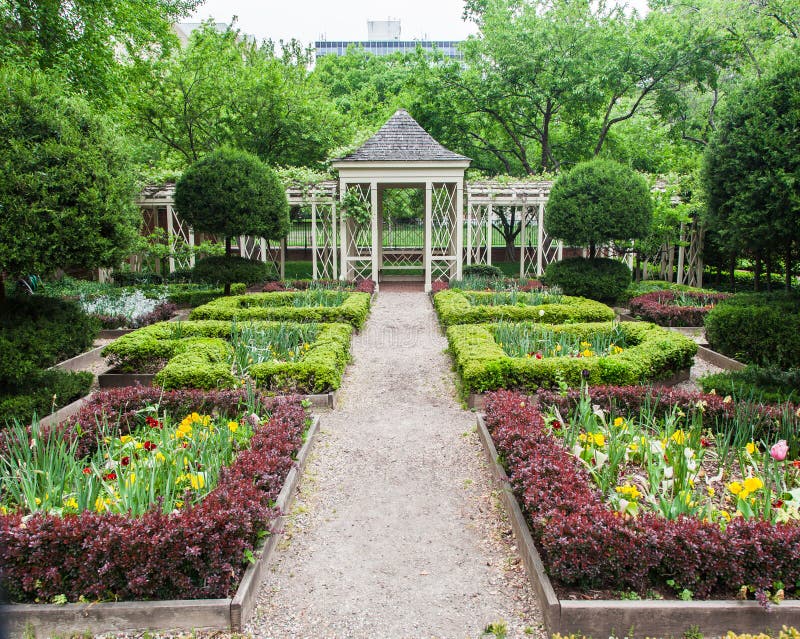 A blooming symmetric garden in Philadelphia historical buildings, Walnut Street, Pennsylvania. A blooming symmetric garden in Philadelphia historical buildings, Walnut Street, Pennsylvania.