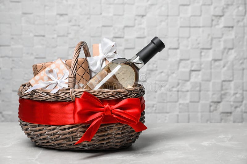 Gift basket with bottle of wine on light background royalty free stock image Gift basket with bottle of wine on light background royalty free stock image