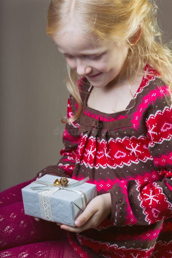 Gift. Beautiful laughing girl holding presents in hands royalty free stock photo Gift. Beautiful laughing girl holding presents in hands royalty free stock photo