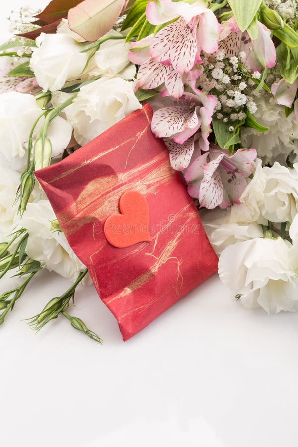 gift-bouquet-flower-red-pack-against-flowers-40429802.jpg