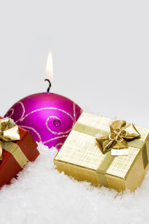 Gift box and candle with snow