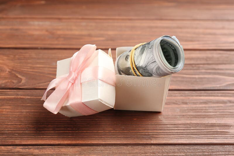 Gift box with dollar bills stock photo. Image of bank 169285910