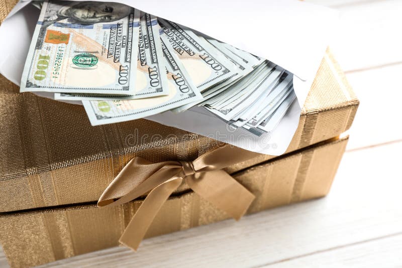 Gift box with dollar bills stock photo. Image of bank 169285910