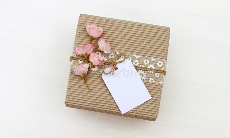 Download Gift Box With Empty Tag Mockup, Flowers Stock Photo ...