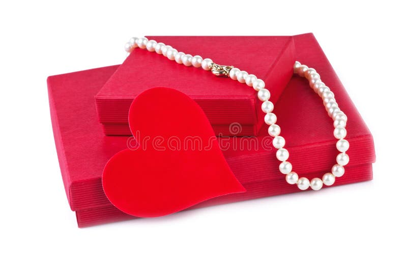 Gift box with red heart and pearl necklace on white