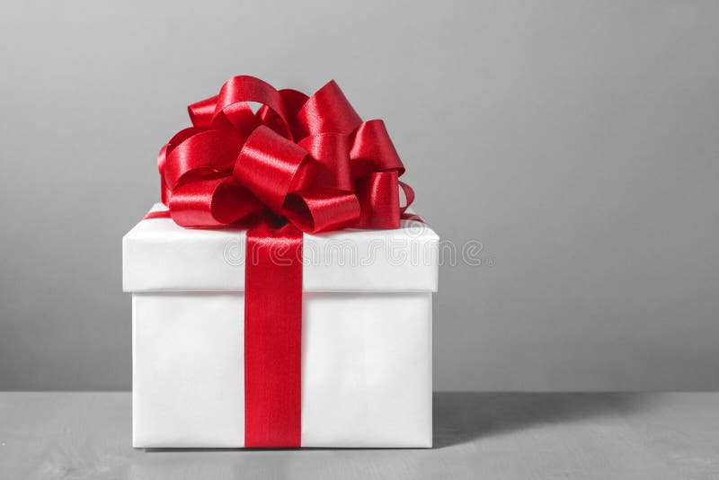 Gift box with red ribbon bow royalty free stock image