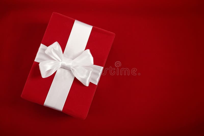 Gift box on red velvet background royalty free stock photos