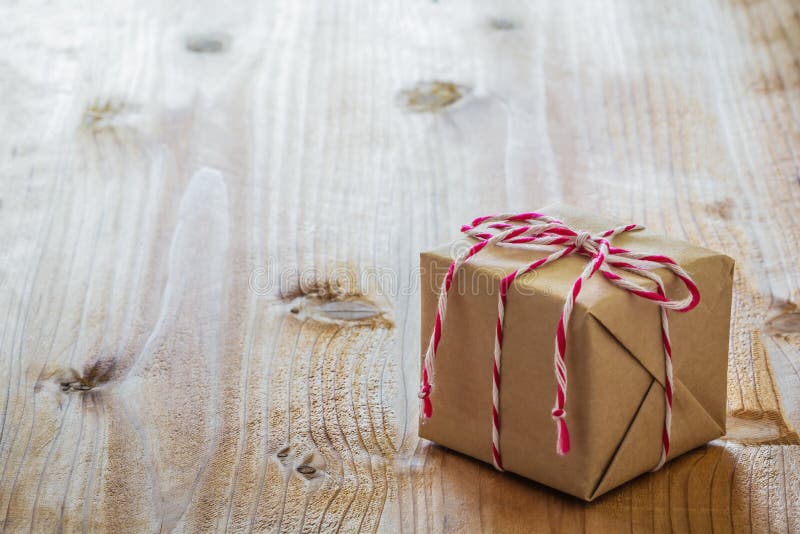 Gift box on wood board stock image. Image of textured 71480979