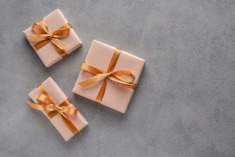 Gift Box with White Daisy Flowers on Yellow Background. Top View with