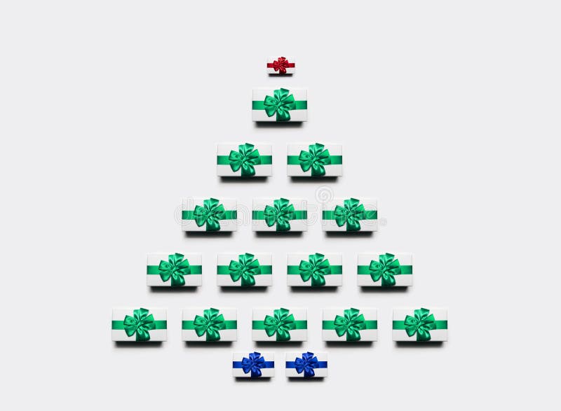 Gift boxes in shape of Christmas tree on white background. stock illustration