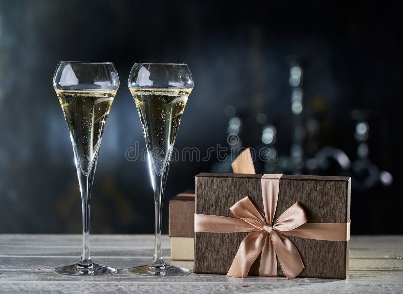 Bronze Gift Boxes and Two Glasses of Champagne Stock Photo Image of