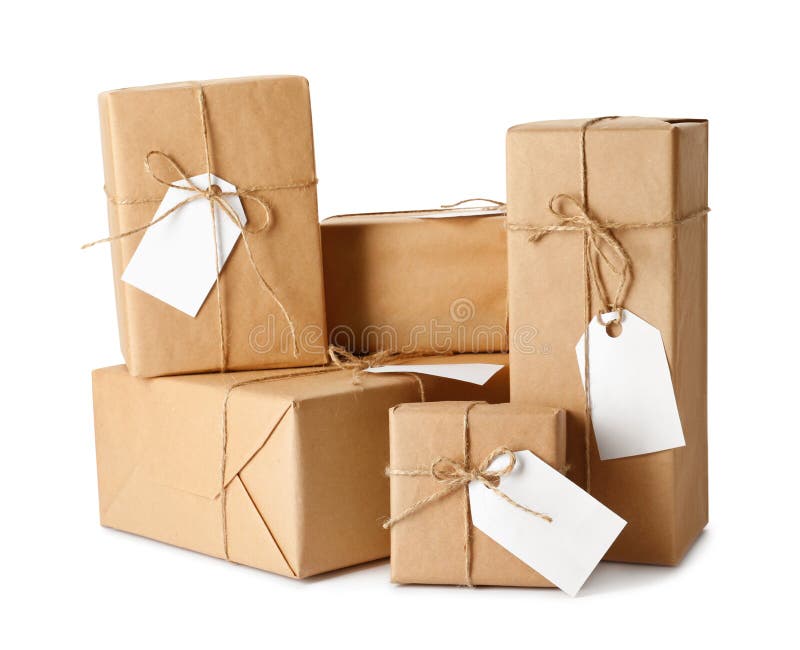 Gift Boxes Wrapped in Kraft Paper with Tags on White Background Stock