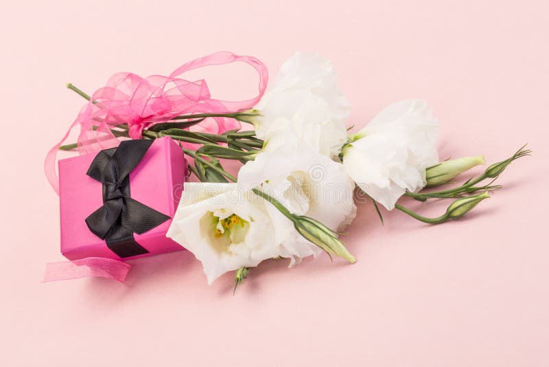 Gift and flowers stock image. Image of ribbon, present 43139729