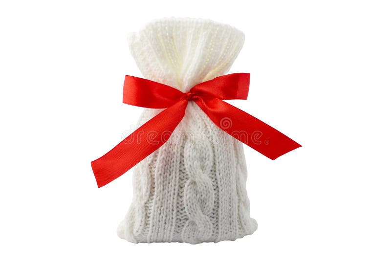 Gift in a knitting bag with a red ribbon. On a white background.