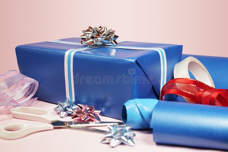 Scissors, Tape, Ribbon And Wrapping Paper On A Gift Box. Focus On Tape  Dispenser. Shallow Depth Of Field. Stock Photo, Picture and Royalty Free  Image. Image 259447.