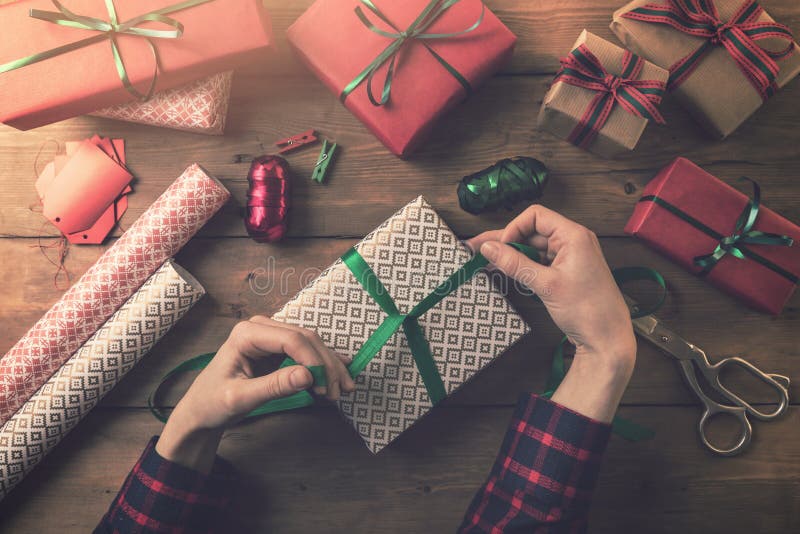 Gift wrapping. woman tie a ribbon bow