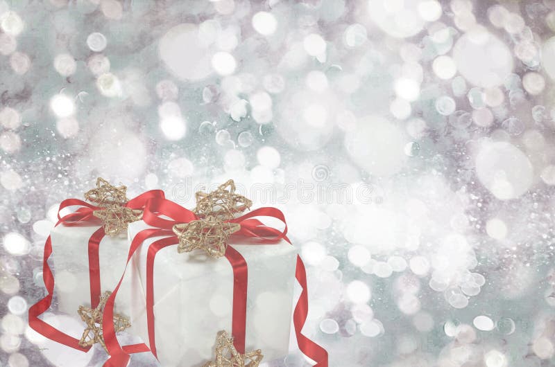 Gifts over Glow glitter background. Elegant abstract background with bokeh stock photography