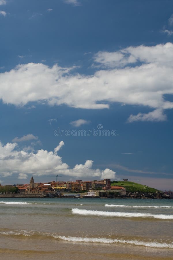 Gijon beach in Spain with cloudy sky