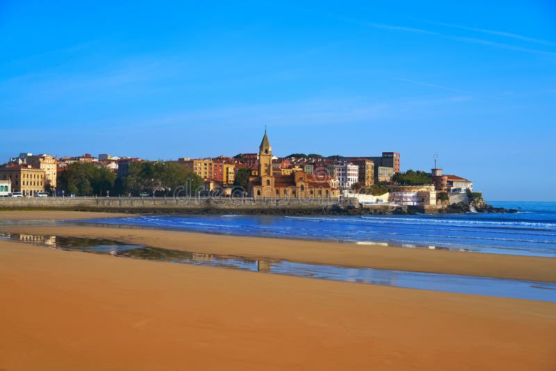 Gijon beach San Lorenzo and San Pedro church in Asturias Spain. Gijon beach San Lorenzo and San Pedro church in Asturias Spain