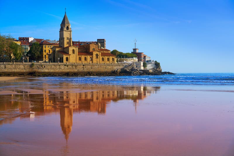 Gijon beach San Lorenzo and San Pedro church in Asturias Spain. Gijon beach San Lorenzo and San Pedro church in Asturias Spain