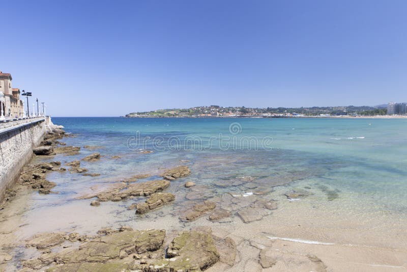 Gijón village, Asturias, Spain, July 10, 2019: San Lorenzo Beach in Gijón Village, Asturias region, Spain. Panoramic view, cityscape. Gijón village, Asturias, Spain, July 10, 2019: San Lorenzo Beach in Gijón Village, Asturias region, Spain. Panoramic view, cityscape