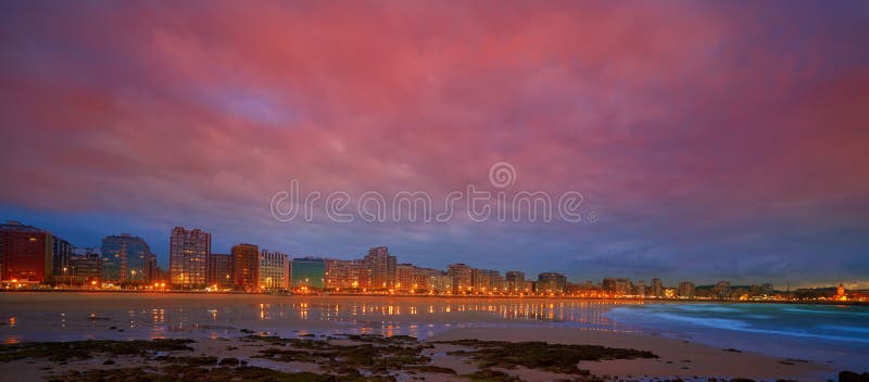 Gijon skyline sunset in San Lorenzo beach of Asturias in Spain. Gijon skyline sunset in San Lorenzo beach of Asturias in Spain