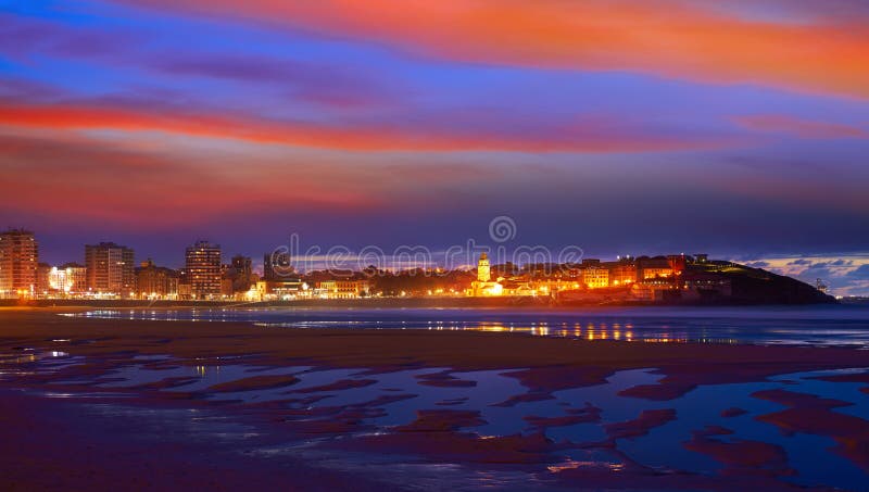 Gijon skyline sunset in San Lorenzo beach of Asturias in Spain. Gijon skyline sunset in San Lorenzo beach of Asturias in Spain