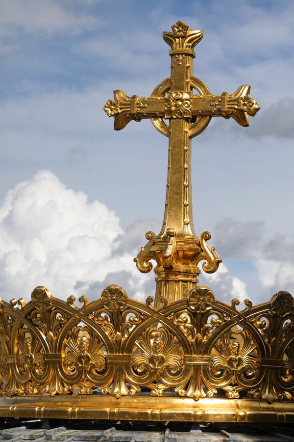 Gilded Christian Cross and Crown on the Roof of the Catholic Church in ...