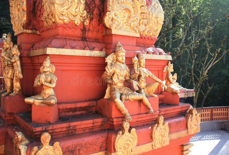 Gilded statues of the Hindu deities, heroes of Ramayana and Lord Hanuman on red vimana tower, Seetha Amman Temple, Seetha Eliya village, Nuwara Eliya, Sri Lanka. Gilded statues of the Hindu deities, heroes of Ramayana and Lord Hanuman on red vimana tower, Seetha Amman Temple, Seetha Eliya village, Nuwara Eliya, Sri Lanka