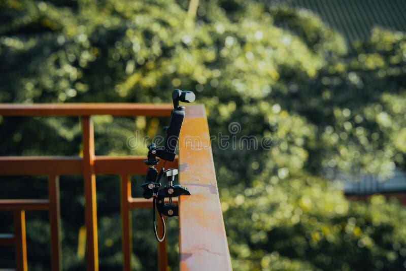 Gimbal camera on tripod capturing time-lapsed video. stock photography