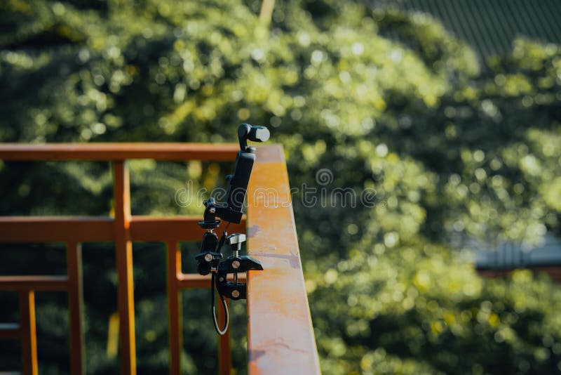 Gimbal camera on tripod capturing time-lapsed video stock images
