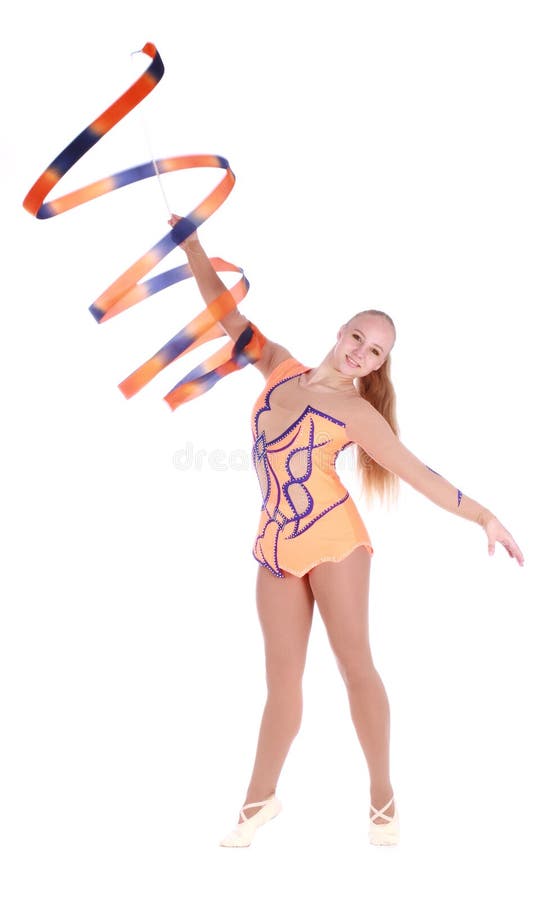 Ginasta flexível bonita da menina com uma fita ginástica imagens de stock Ginasta flexível bonita da menina com uma fita ginástica imagens de stock