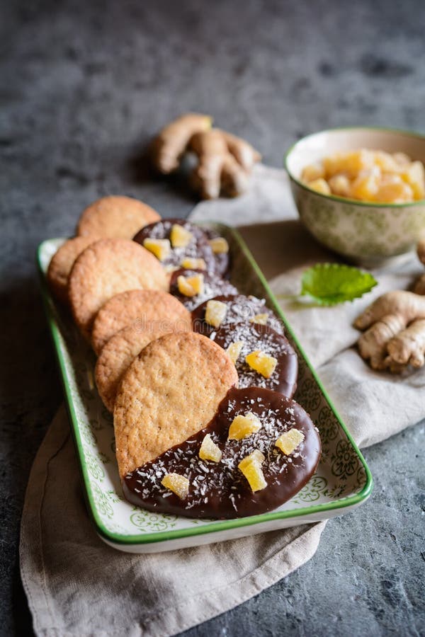 Ginger Biscuits Decorated with Chocolate and Pieces of Candied Ginger
