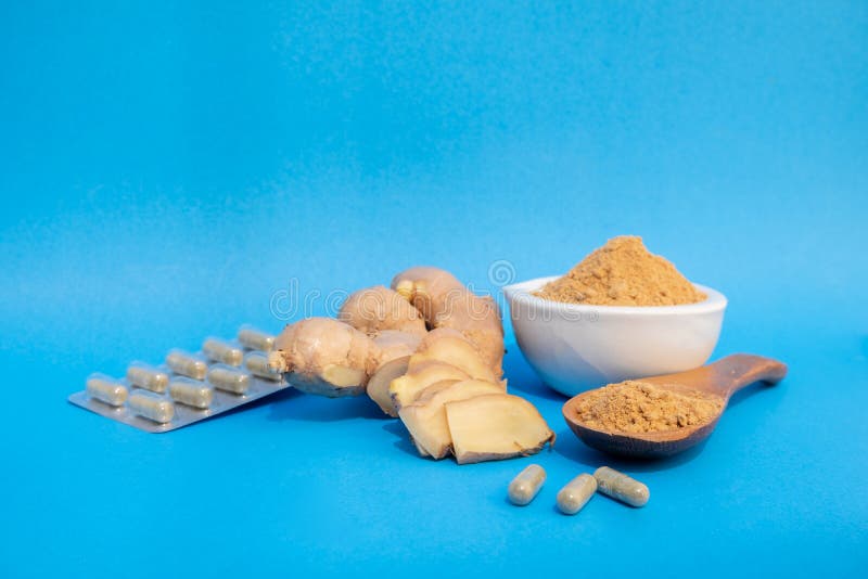 Ginger Fresh and Ginger Powder on Blue Background. Concept Healthy