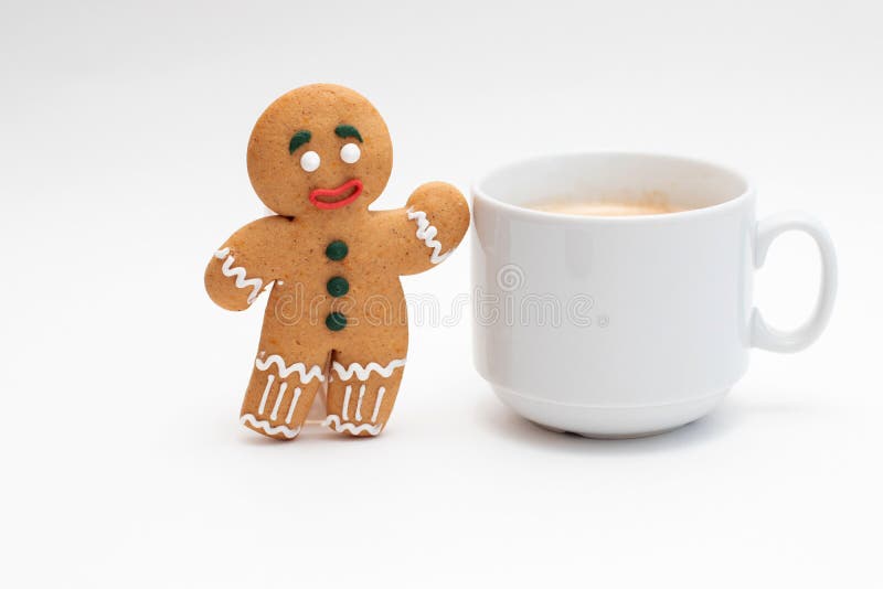 Gingerbread classic decorated cookie with cup of coffee royalty free stock photography