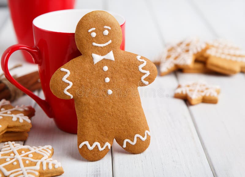 Gingerbread cookie against red cup with cocoa royalty free stock images